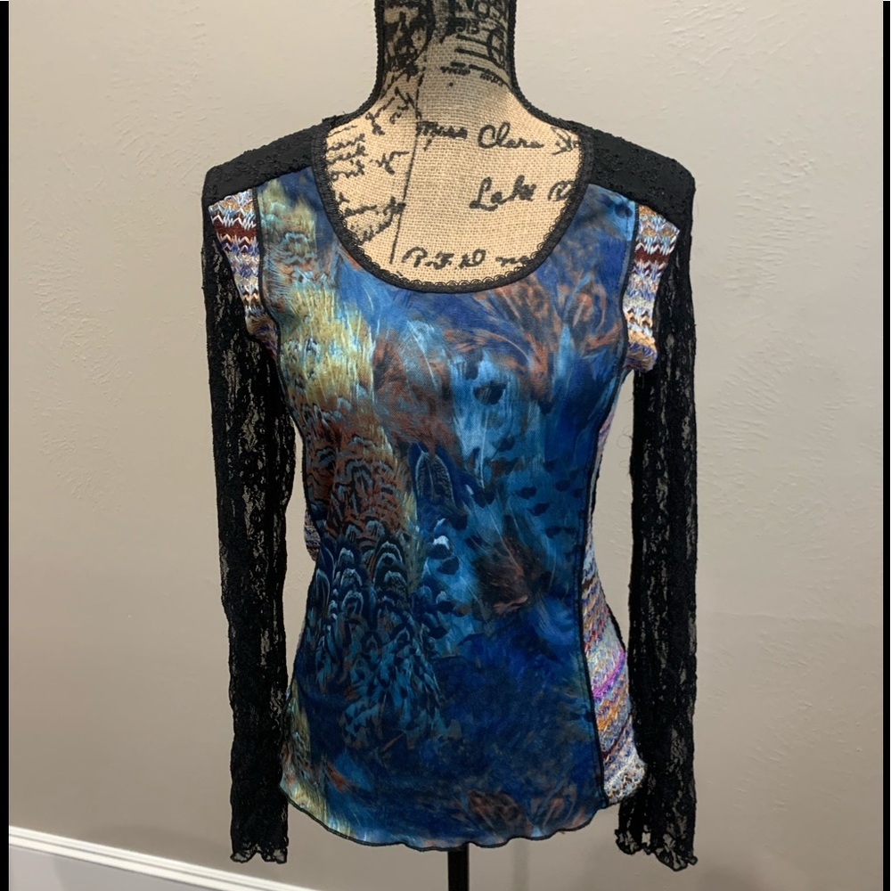 Just living top in size 3/ L. Black lace sleeves blue multi pattern. Good shape